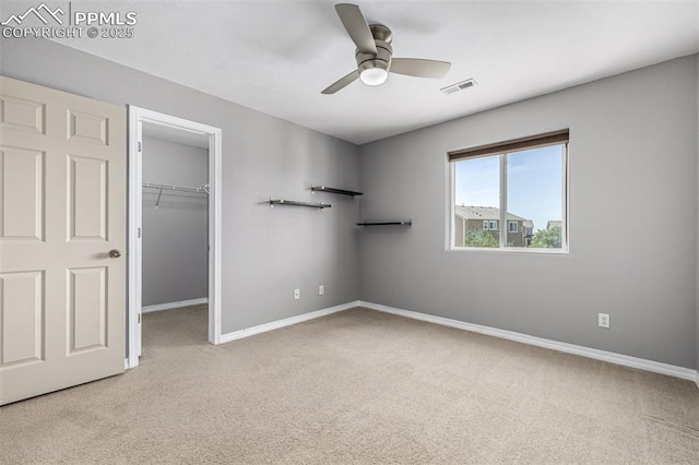 5718 Badenoch Ter, Colorado Springs, CO 80923 - unfurnished bedroom with carpet flooring, a walk in closet, a closet, and ceiling fan