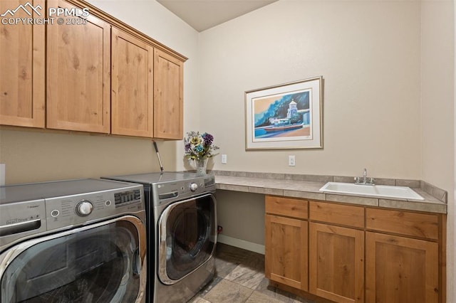 15704 Pole Pine Pt, Colorado Springs, CO 80908 - laundry area with cabinet space and washer and clothes dryer