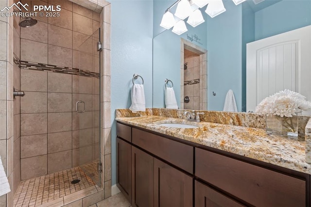 15704 Pole Pine Pt, Colorado Springs, CO 80908 - full bathroom with a skylight, a stall shower, vanity, and tile patterned floors