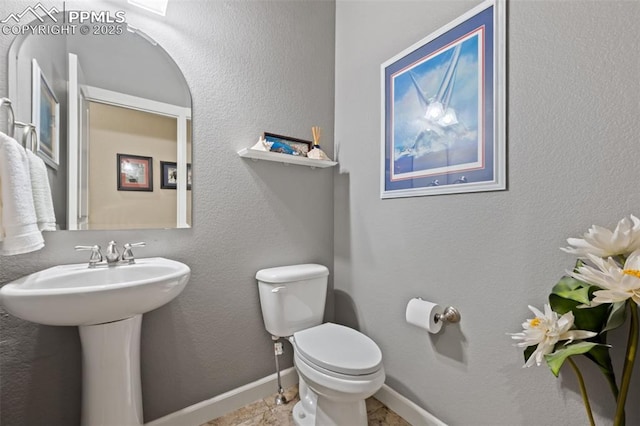 15704 Pole Pine Pt, Colorado Springs, CO 80908 - bathroom with toilet and a sink