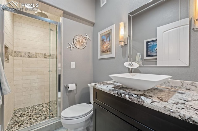 15704 Pole Pine Pt, Colorado Springs, CO 80908 - full bathroom with a shower stall and vanity