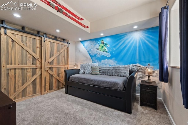15704 Pole Pine Pt, Colorado Springs, CO 80908 - carpeted bedroom with a barn door and recessed lighting