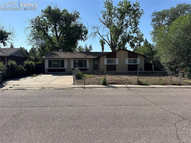 131 Cornell St, Colorado Springs, CO 80911 - view of front of house featuring a fenced front yard and concrete driveway