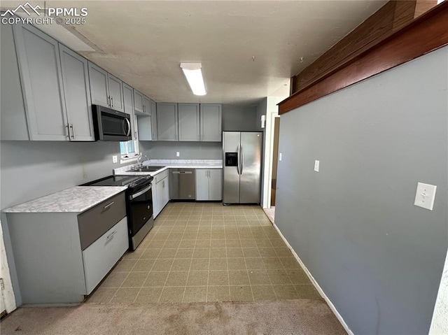 131 Cornell St, Colorado Springs, CO 80911 - kitchen with stainless steel appliances, gray cabinets, and light countertops