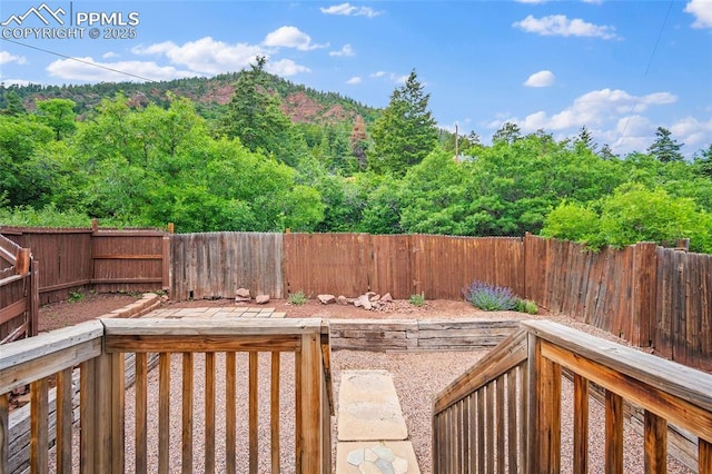 354 Corona Ave, Palmer Lake, CO 80133 - wooden terrace featuring a fenced backyard