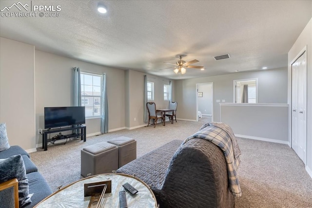 8285 Lodge Grass Way, Colorado Springs, CO 80908 - carpeted living room with a ceiling fan and recessed lighting