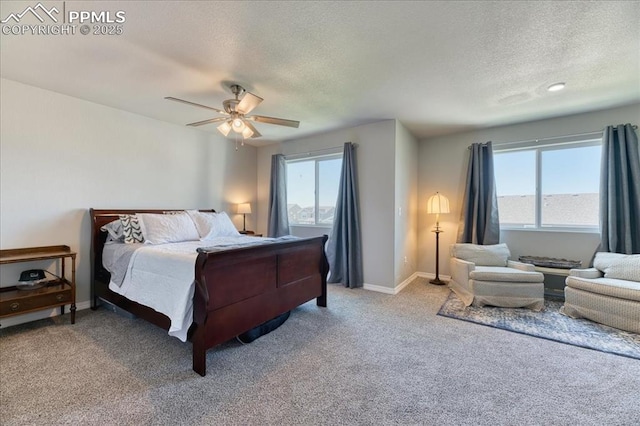 8285 Lodge Grass Way, Colorado Springs, CO 80908 - bedroom featuring a textured ceiling, multiple windows, light carpet, and a ceiling fan