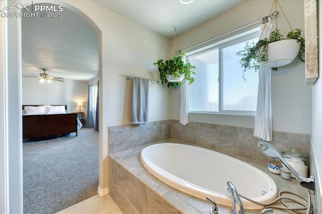 8285 Lodge Grass Way, Colorado Springs, CO 80908 - bathroom featuring ensuite bathroom, a garden tub, tile patterned floors, and a ceiling fan