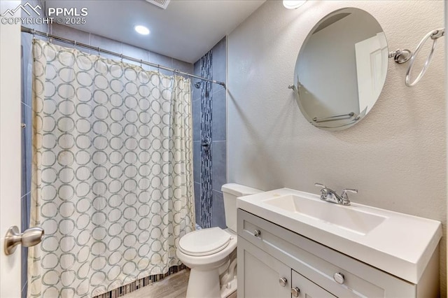 8285 Lodge Grass Way, Colorado Springs, CO 80908 - full bath featuring vanity, a shower with curtain, and wood finished floors