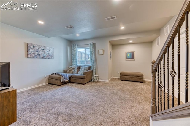 8285 Lodge Grass Way, Colorado Springs, CO 80908 - carpeted living area with stairway and recessed lighting