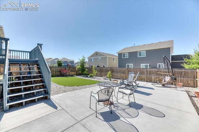 8285 Lodge Grass Way, Colorado Springs, CO 80908 - fenced backyard featuring a patio area, stairway, and a residential view