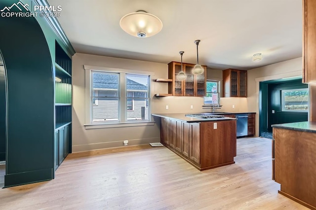 420 E Fontanero St, Colorado Springs, CO 80907 - kitchen featuring stainless steel dishwasher, open shelves, light wood-style flooring, and a peninsula