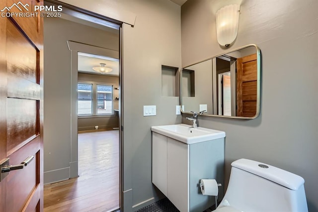 420 E Fontanero St, Colorado Springs, CO 80907 - bathroom featuring wood finished floors and vanity