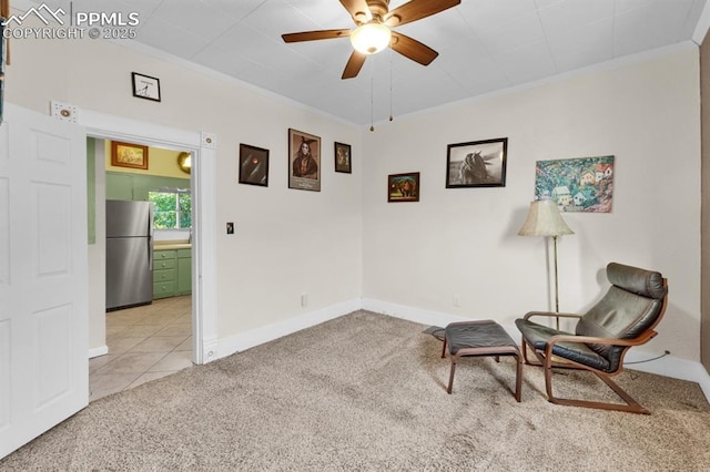 1339 Arch St, Colorado Springs, CO 80904 - sitting room with carpet floors, a ceiling fan, ornamental molding, and tile patterned floors