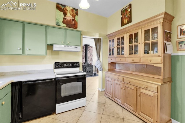 1339 Arch St, Colorado Springs, CO 80904 - kitchen featuring range with electric cooktop, black dishwasher, under cabinet range hood, light countertops, and green cabinetry