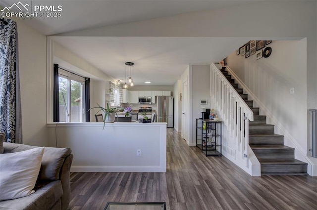4530 W Jet Wing Cir, Colorado Springs, CO 80916 - living area with dark wood-type flooring and stairway