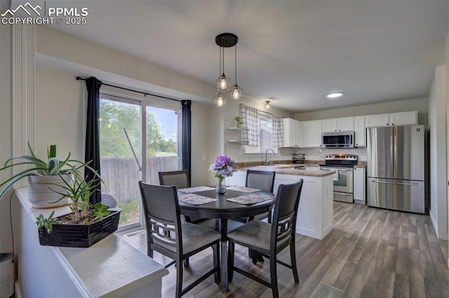 4530 W Jet Wing Cir, Colorado Springs, CO 80916 - dining area with wood finished floors and recessed lighting