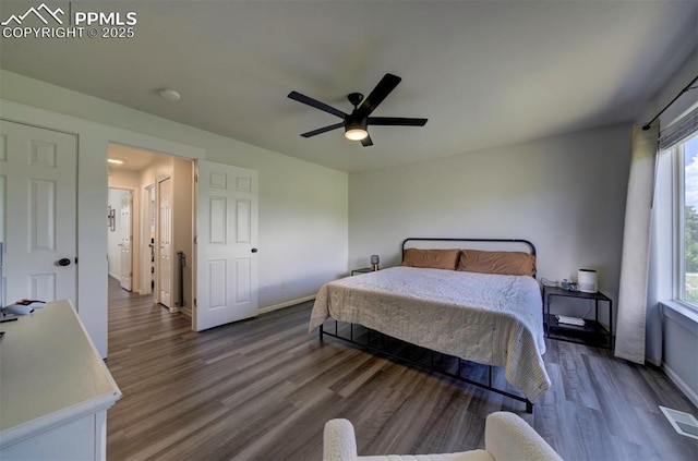 4530 W Jet Wing Cir, Colorado Springs, CO 80916 - bedroom with wood finished floors, multiple windows, and a ceiling fan