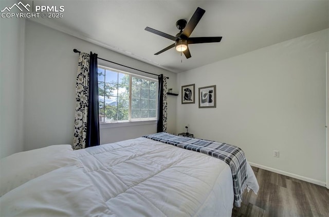 4530 W Jet Wing Cir, Colorado Springs, CO 80916 - bedroom featuring wood finished floors and a ceiling fan