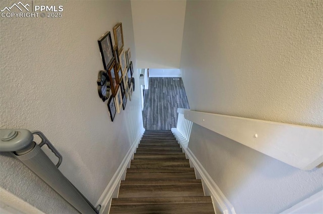 4530 W Jet Wing Cir, Colorado Springs, CO 80916 - stairs featuring wood finished floors and a textured wall