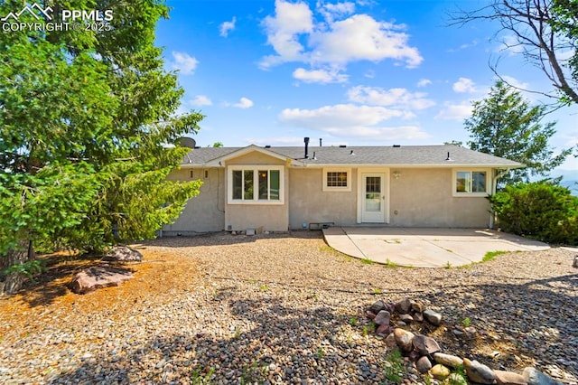 3970 Old Ranch Rd, Colorado Springs, CO 80908 - back of house featuring stucco siding and a patio area
