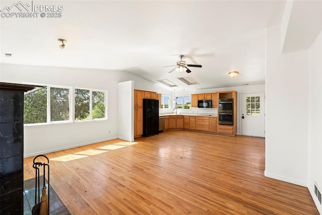 3970 Old Ranch Rd, Colorado Springs, CO 80908 - unfurnished living room with light wood-style floors, a ceiling fan, and vaulted ceiling