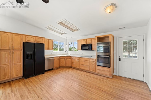 3970 Old Ranch Rd, Colorado Springs, CO 80908 - kitchen with black appliances, lofted ceiling, light wood-type flooring, light countertops, and open shelves