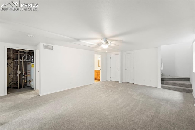 3970 Old Ranch Rd, Colorado Springs, CO 80908 - unfurnished living room featuring ceiling fan, carpet, stairway, and water heater