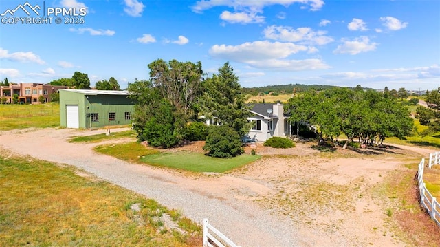 3970 Old Ranch Rd, Colorado Springs, CO 80908 - view of side of home featuring a detached garage and driveway