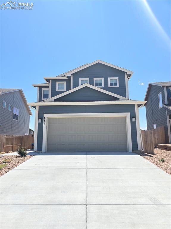 8136 Kittrick Pl, Peyton, CO 80831 - view of front facade with concrete driveway and a garage