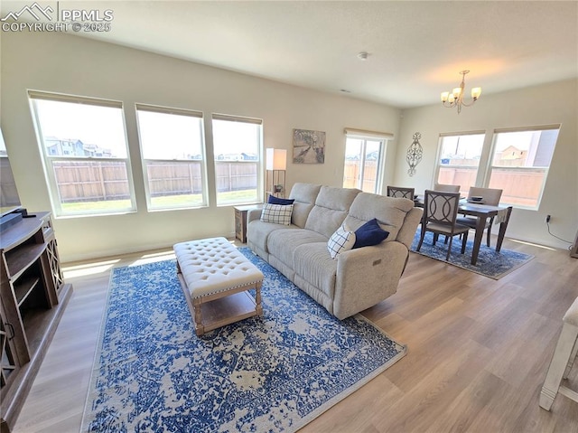 8136 Kittrick Pl, Peyton, CO 80831 - living room featuring a chandelier and wood finished floors