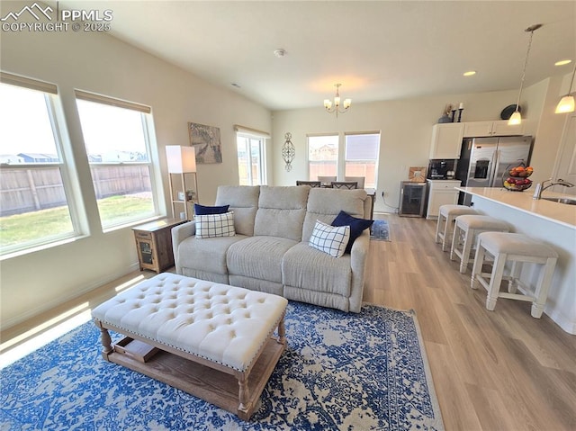 8136 Kittrick Pl, Peyton, CO 80831 - living area with a chandelier, light wood-style floors, and recessed lighting