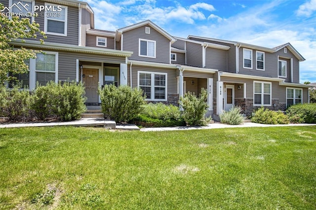 8170 Snow Bowl Hts, Fountain, CO 80817 - townhome / multi-family property with a front yard and stone siding
