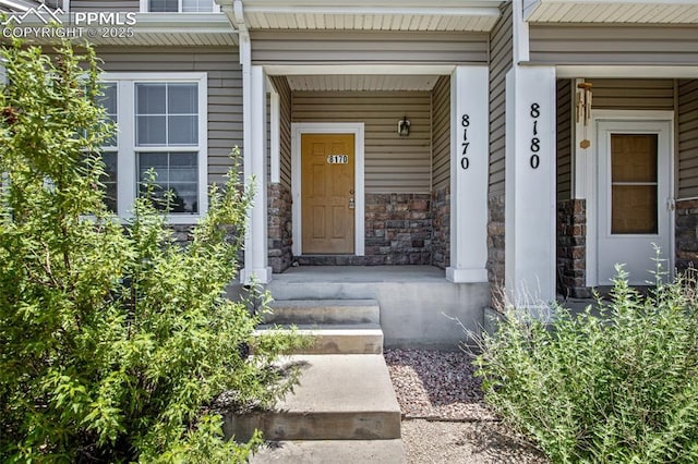 8170 Snow Bowl Hts, Fountain, CO 80817 - doorway to property with stone siding and covered porch