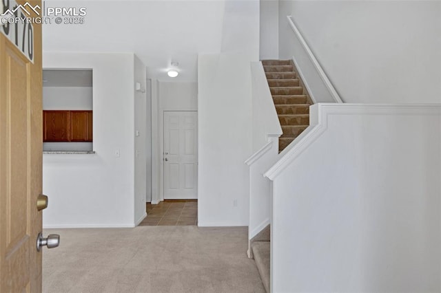 8170 Snow Bowl Hts, Fountain, CO 80817 - carpeted foyer with stairs