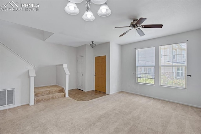 8170 Snow Bowl Hts, Fountain, CO 80817 - unfurnished living room with carpet floors, stairway, plenty of natural light, and a ceiling fan