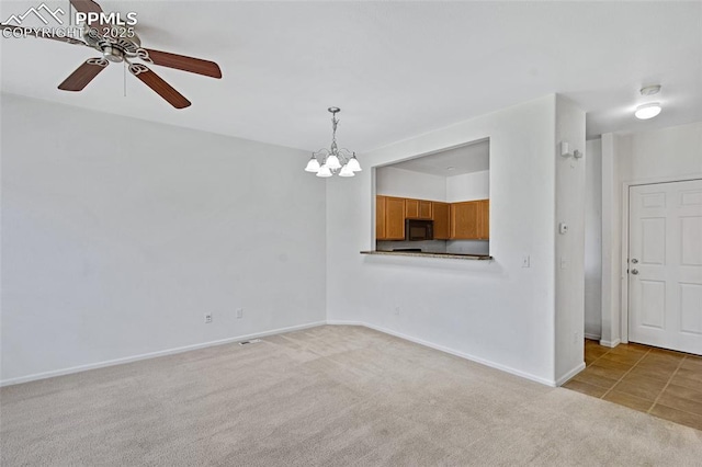 8170 Snow Bowl Hts, Fountain, CO 80817 - unfurnished room with a ceiling fan, light carpet, a chandelier, and a smoke detector