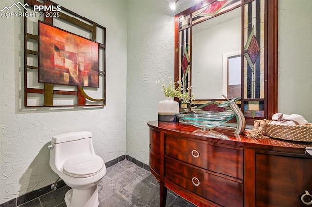 780 Mission Hill Way, Colorado Springs, CO 80921 - half bath with vanity and a textured wall