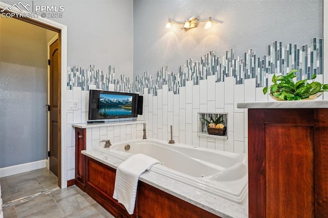780 Mission Hill Way, Colorado Springs, CO 80921 - full bathroom featuring a tub with jets and baseboards