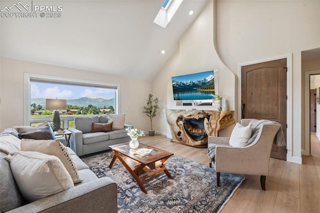 780 Mission Hill Way, Colorado Springs, CO 80921 - living area with high vaulted ceiling, a skylight, wood finished floors, and recessed lighting