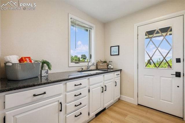 780 Mission Hill Way, Colorado Springs, CO 80921 - bar with a sink and light wood-style flooring