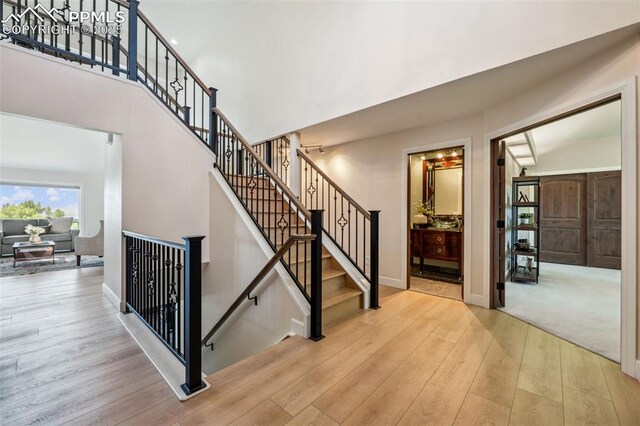780 Mission Hill Way, Colorado Springs, CO 80921 - stairs with wood finished floors and a towering ceiling