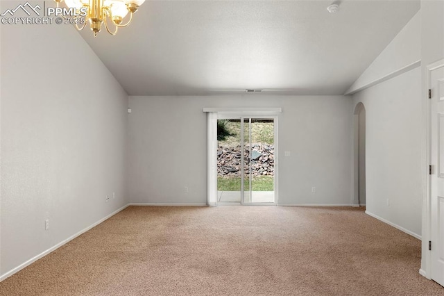 7605 Artisan Pl, Fountain, CO 80817 - unfurnished room featuring arched walkways, carpet, vaulted ceiling, a chandelier, and a smoke detector