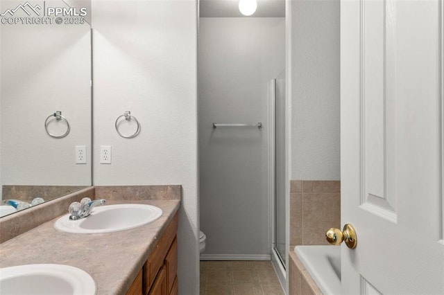 7605 Artisan Pl, Fountain, CO 80817 - bathroom with double vanity, a stall shower, and a bathtub