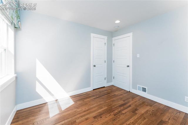 1514 W Platte Ave, Colorado Springs, CO 80904 - spare room featuring dark wood-type flooring, recessed lighting, and a smoke detector