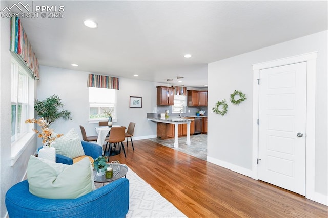 1514 W Platte Ave, Colorado Springs, CO 80904 - living room with light wood-style floors and recessed lighting