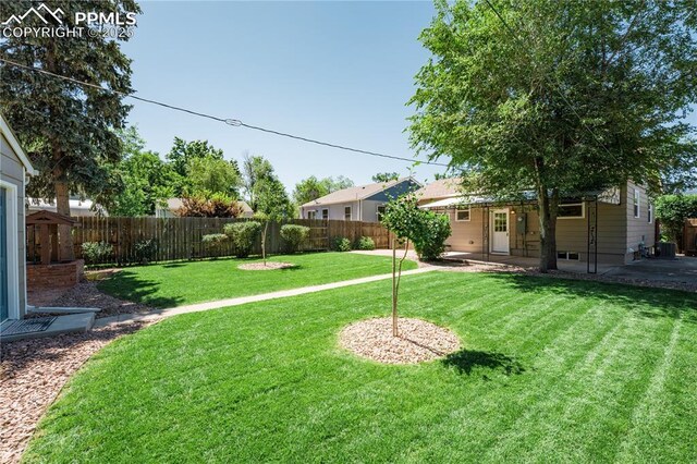 1514 W Platte Ave, Colorado Springs, CO 80904 - fenced backyard featuring a patio area