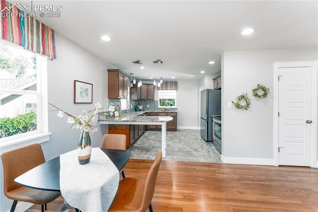 1514 W Platte Ave, Colorado Springs, CO 80904 - dining space featuring recessed lighting and light wood-style floors