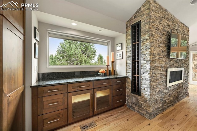 1282 Hill Cir, Colorado Springs, CO 80904 - bar with vaulted ceiling, light wood finished floors, healthy amount of natural light, and recessed lighting