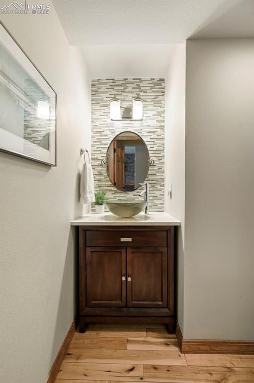 1282 Hill Cir, Colorado Springs, CO 80904 - bathroom featuring wood finished floors and vanity
